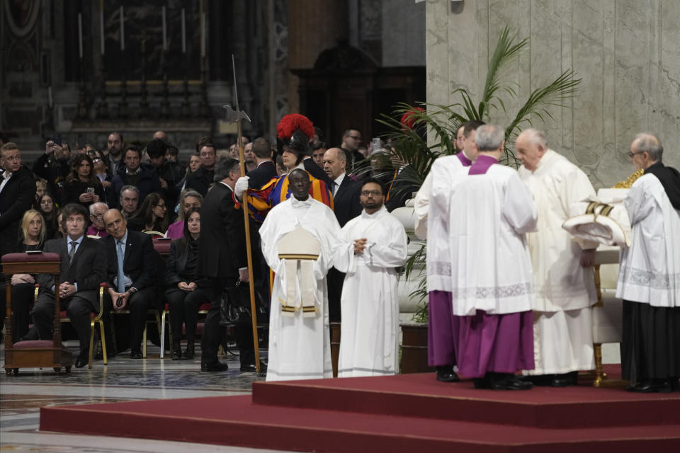 From left, Argentine Secretary-General of the Presidency Karina Milei, Argentine President Javier Milei, Interior Minister Guillermo Francos, and Minister of Human Capital Sandra Pettovello attend in St. Peter's Basilica at The Vatican, Sunday, Feb. 11, 2024, the canonization of new Argentine Saint, María Antonia de Paz y Figueroa also known as "Mama Antula" presided over by Pope Francis, right. (AP Photo/Alessandra Tarantino)