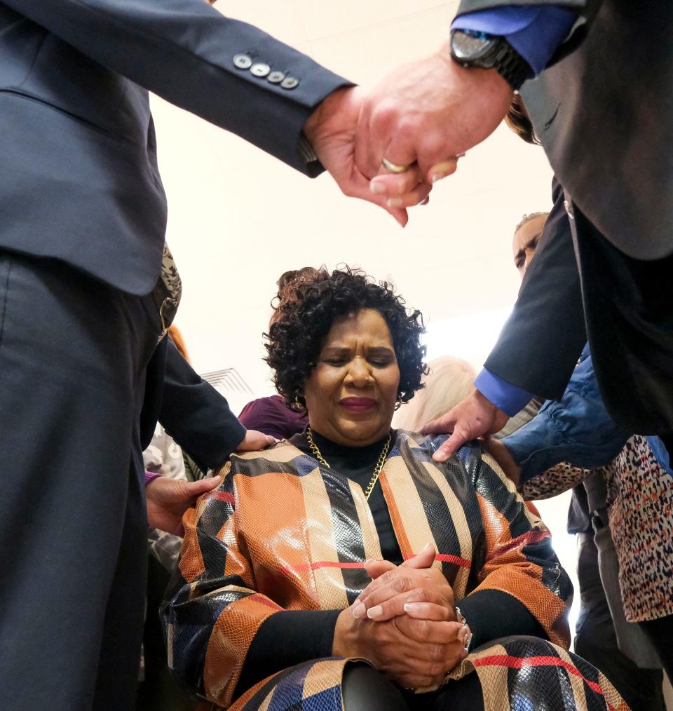 Pastors, chaplains, and friends gather around and pray for Alice Marie Johnson who celebrated the fifth anniversary of her release from the Federal Correctional Institution, Aliceville at Aliceville Baptist Church on Monday, Oct. 16, 2023. Johnson was returning to FCI Aliceville to speak to graduates of the Life Connections Pilot Program.