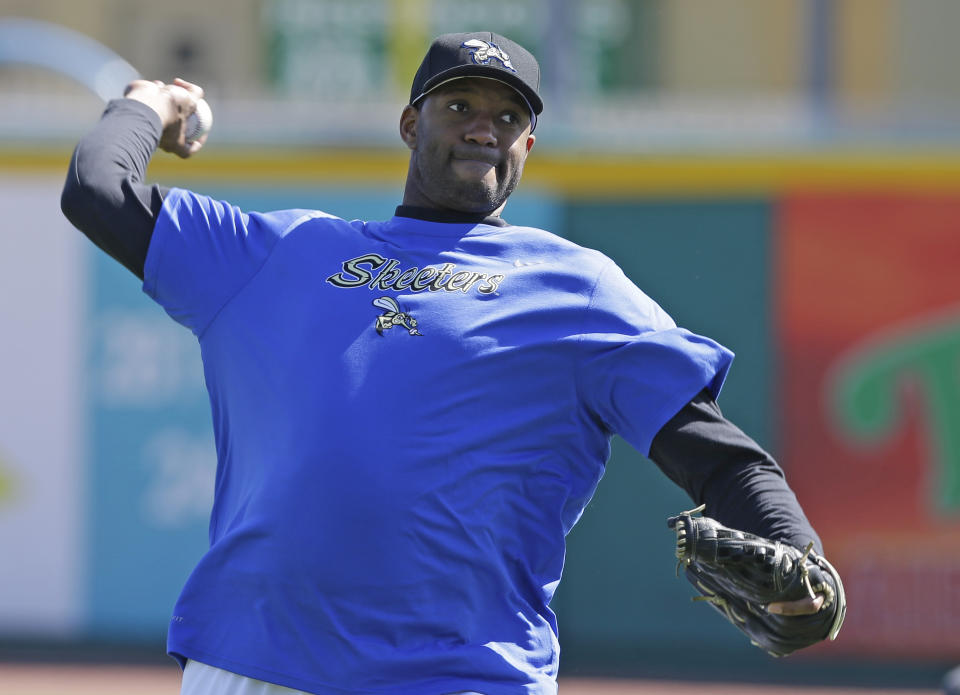 Retired NBA All-Star Tracy McGrady throws a pitch at the Sugar Land Skeeters baseball stadium Wednesday, Feb. 12, 2014, in Sugar Land, Texas. McGrady hopes to try out as a pitcher for the independent Atlantic League Skeeters. (AP Photo/Pat Sullivan)