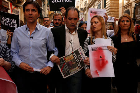 (L to R) Journalists Herman Grech, Dione Borg, Rachel Attard and Norma Saliba lead a protest following the assassination of investigative journalist Daphne Caruana Galizia in a car bomb attack three days ago, in Valletta, Malta, October 19, 2017. REUTERS/Darrin Zammit Lupi