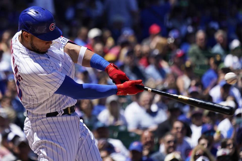 Chicago Cubs' Willson Contreras hits a single during the first inning of a baseball game against the Atlanta Braves in Chicago, Saturday, June 18, 2022. (AP Photo/Nam Y. Huh)