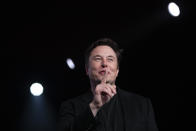 FILE- In this March 14, 2019, file photo Tesla CEO Elon Musk speaks before unveiling the Model Y at Tesla's design studio in Hawthorne, Calif. Musk is taking on the workhorse heavy pickup truck market with his latest electric vehicle. The CEO of Tesla will unveil a new electric pickup truck at the Los Angeles Auto Show Thursday, Nov. 21, 2019. (AP Photo/Jae C. Hong, File)