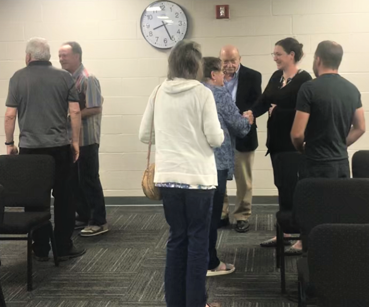 Villanova Road homeowners chat after seeing an idea to squeeze rental homes into their neighborhood rejected at the Glassboro Planning Board meeting on Tuesday night. Homeowners voiced concerns Rowan University students were the intended renters. PHOTO: May 7, 2024.