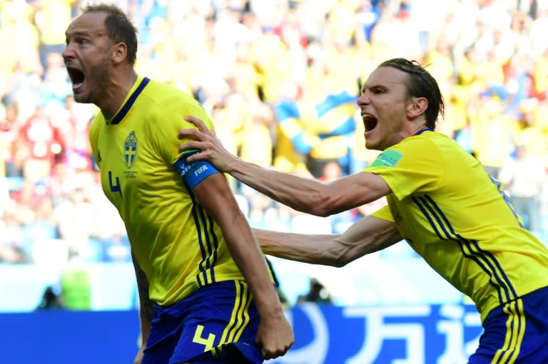 Sweden defender Andreas Granqvist (left) celebrates after scoring a penalty against South Korea