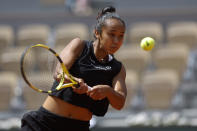 Canada's Leylah Fernandez plays a shot against Italy's Martina Trevisan during their quarterfinal match at the French Open tennis tournament in Roland Garros stadium in Paris, France, Tuesday, May 31, 2022. (AP Photo/Jean-Francois Badias)