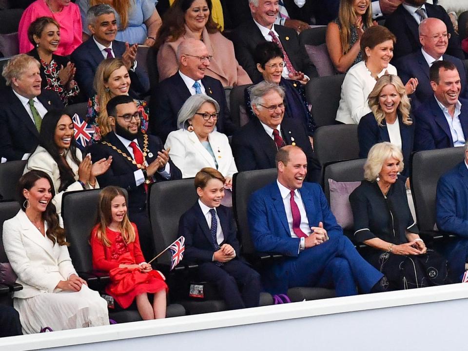 The siblings laughed as they watched the show (POOL/AFP via Getty Images)