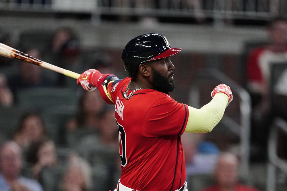 Atlanta Braves’ Marcell Ozuna (20) follows through on a solo home run during the sixth inning of the team’s baseball game against the Pittsburgh Pirates on Friday, May 21, 2021, in Atlanta. (AP Photo/John Bazemore)