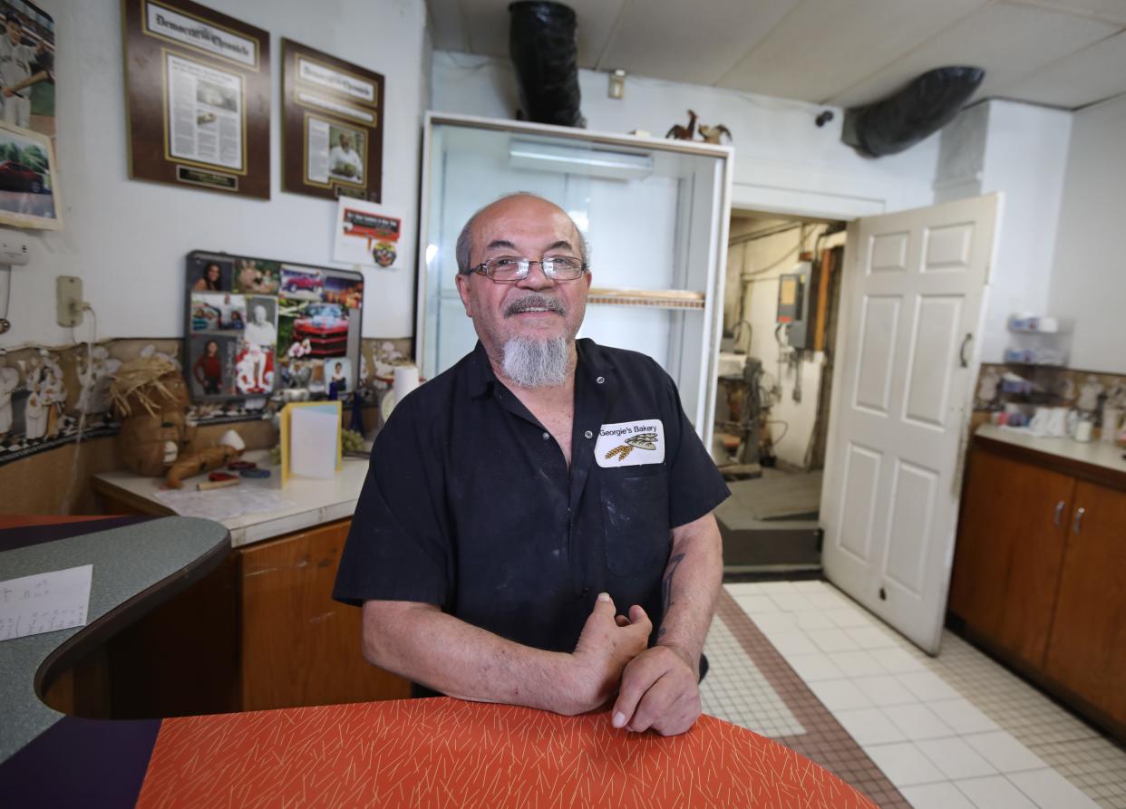 George Ruiz, owner, is back behind the counter at his Georgie's Bakery and Cafe on South Clinton Ave in Rochester Thursday, May 2, 2024. The popular Highland Park Neighborhood bakery was closed for the last six months but reopened on Thursday.