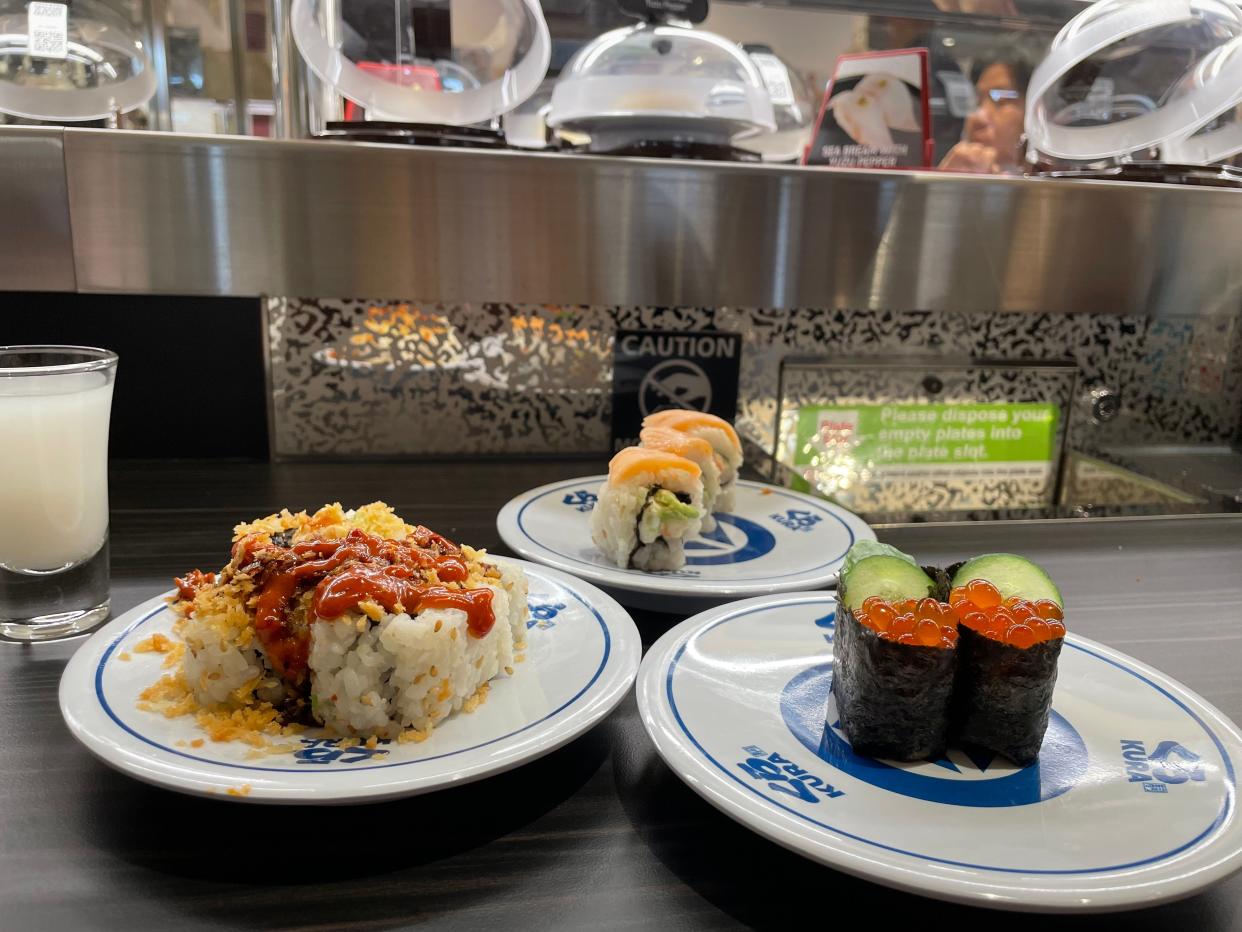 Some of the sushi options at Kura Revolving Sushi Bar, where dishes are delivered via a conveyor belt and ordered via a touchscreen. Photographed April 21, 2024