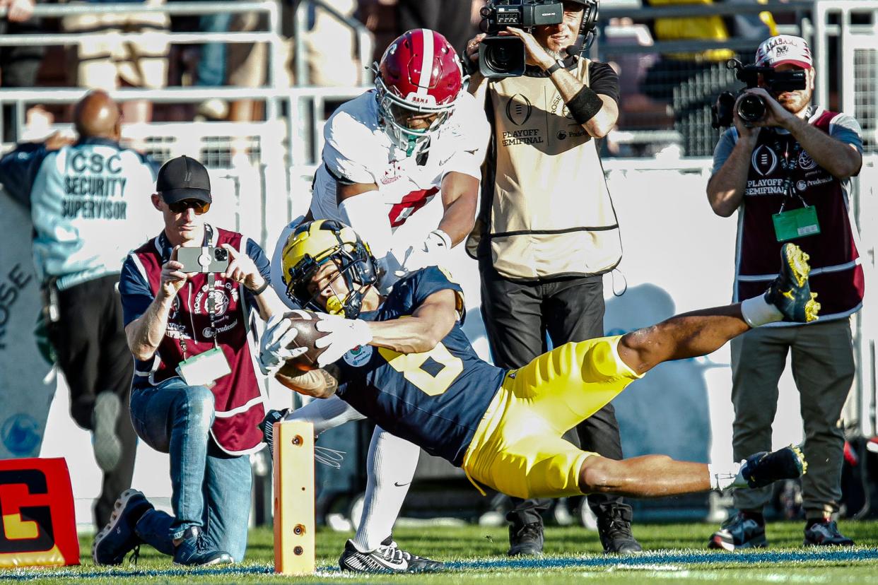 Michigan wide receiver Tyler Morris scores a touchdown against Alabama defensive back Jaylen Key during the first half of the Rose Bowl in Pasadena, California, on Monday, Jan. 1, 2024.