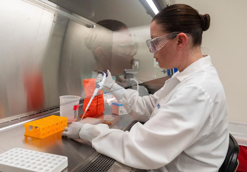 Dr. Rhonda Flores looks at protein samples at Novavax labs in Gaithersburg, Maryland on March 20, 2020, one of the labs developing a vaccine for the coronavirus, COVID-19. (Photo by ANDREW CABALLERO-REYNOLDS / AFP) / The erroneous mention[s] appearing in the metadata of this photo by ANDREW CABALLERO-REYNOLDS has been modified in AFP systems in the following manner: [Gaithersburg] instead of [Rockville]. Please immediately remove the erroneous mention[s] from all your online services and delete it (them) from your servers. If you have been authorized by AFP to distribute it (them) to third parties, please ensure that the same actions are carried out by them. Failure to promptly comply with these instructions will entail liability on your part for any continued or post notification usage. Therefore we thank you very much for all your attention and prompt action. We are sorry for the inconvenience this notification may cause and remain at your disposal for any further information you may require. (Photo by ANDREW CABALLERO-REYNOLDS/AFP via Getty Images)