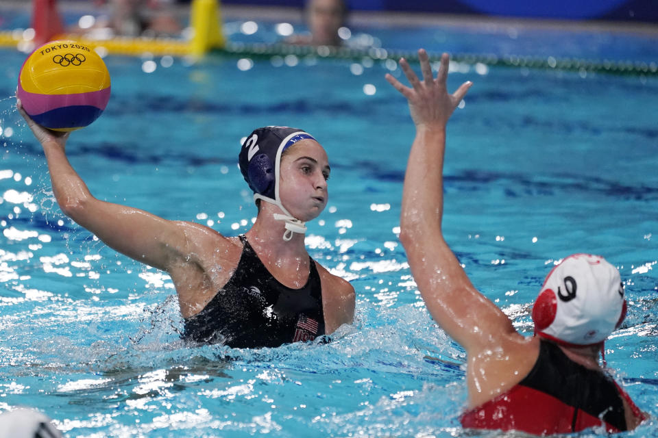 United States' Madeline Musselman (2) shoots against Canada's Hayley McKelvey (9) during a quarterfinal round women's water polo match at the 2020 Summer Olympics, Tuesday, Aug. 3, 2021, in Tokyo, Japan. (AP Photo/Mark Humphrey)