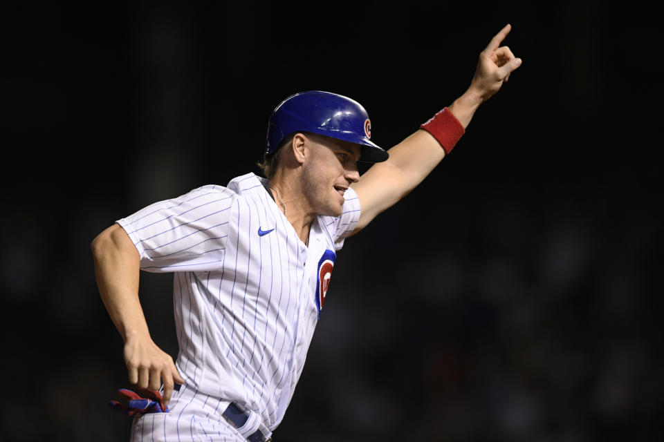 Chicago Cubs' Patrick Wisdom celebrates while rounding third base after Jason Heyward hit a game-ending, three-run home against the Cincinnati Reds during the 10th inning of a baseball game Wednesday, Sept. 8, 2021, in Chicago. The Cubs won 4-1. (AP Photo/Paul Beaty)