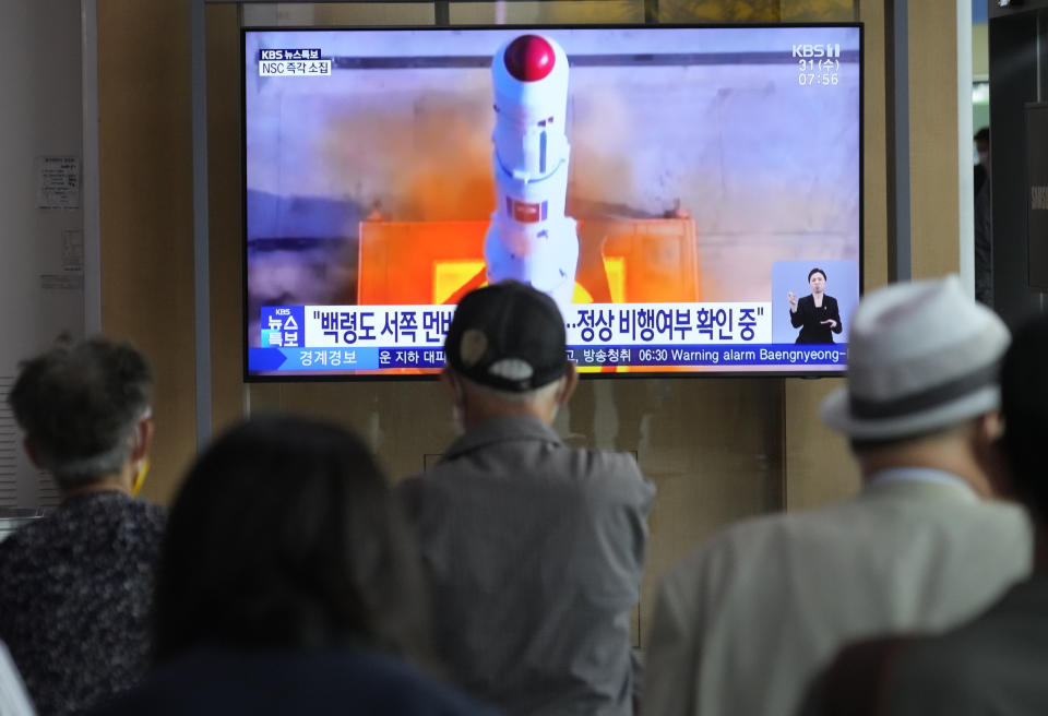 A TV screen shows a file image of North Korea's rocket launch during a news program at the Seoul Railway Station in Seoul, South Korea, Wednesday, May 31, 2023. North Korea launched a purported rocket Wednesday, a day after the country announced a plan to put its first military spy satellite into orbit, South Korea's military said. (AP Photo/Ahn Young-joon)