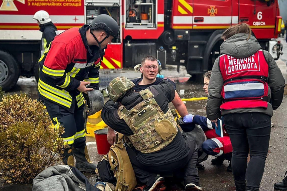 In this photo provided by the Ukrainian Emergency Service, emergency services help their colleague injured during a Russian attack (AP)