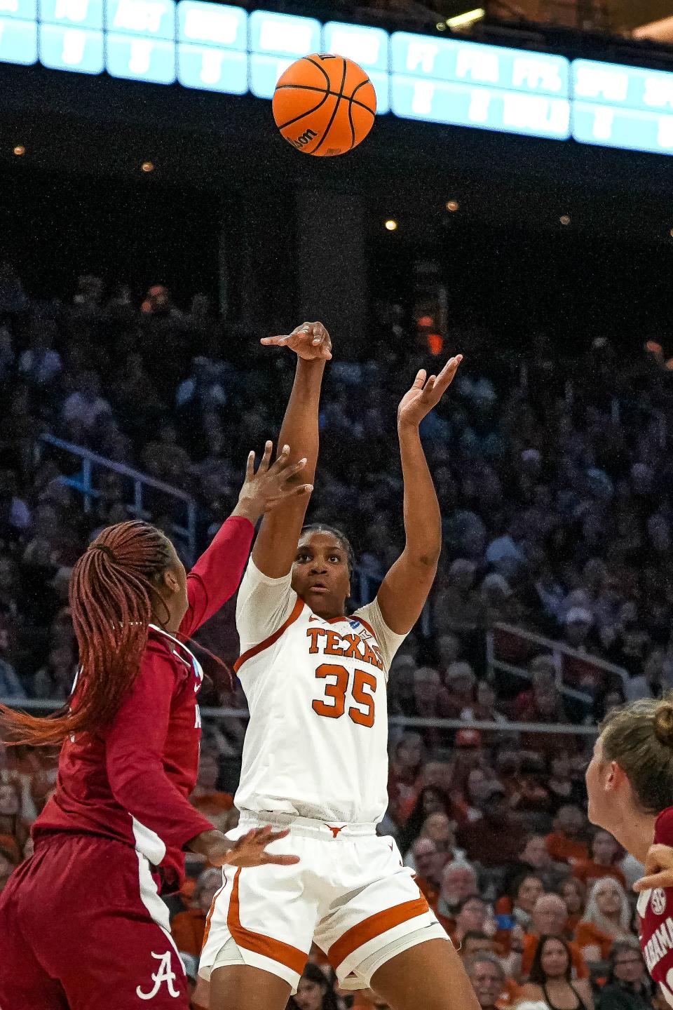 Texas point guard Madison Booker shoots over Alabama center Jeanna Cunningham during the Longhorns' second-round win this past Sunday in the NCAA Women's Tournament. Texas is playing in this weekend's Sweet 16 in Portland, Ore.