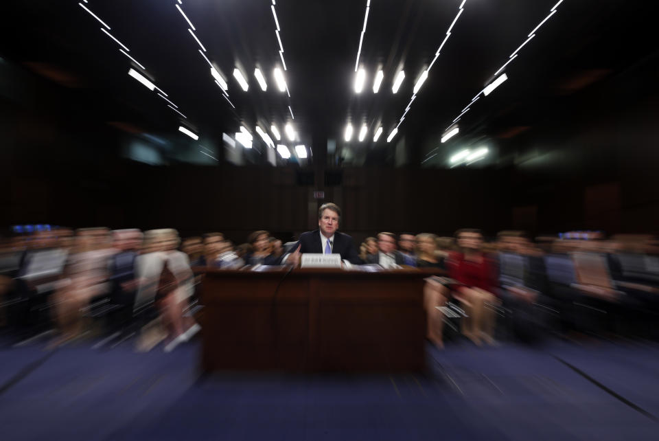 FILE - In this Thursday, Sept. 6, 2018 file photo made with a slow shutter speed and a zoom lens, President Donald Trump's Supreme Court nominee, Brett Kavanaugh testifies before the Senate Judiciary Committee on Capitol Hill in Washington, for the third day of his confirmation hearing. On Thursday, Sept. 20, 2018, an attorney for Christine Blasey Ford said she would testify to the Senate next week about her accusation that Kavanaugh assaulted her when both were high school students if agreement can be reached to "terms that are fair and which ensure her safety.” (AP Photo/Alex Brandon)