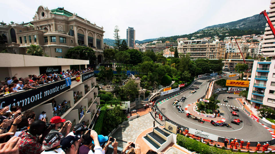 The field of drivers snakes around the Fairmont Hairpin during the initial lap of the 2012 Monaco Grand Prix.