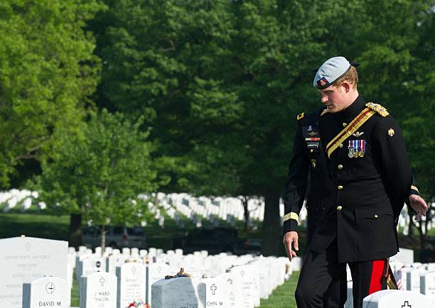 Prince Harry, wearing his British Army ceremonial uniform of the Blues And Royals in his role as Captain Harry Wales visits Section 60 of Arlington National Cemetery, where veterans of the wars in Iraq and Afghanistan are buried (Getty Images)