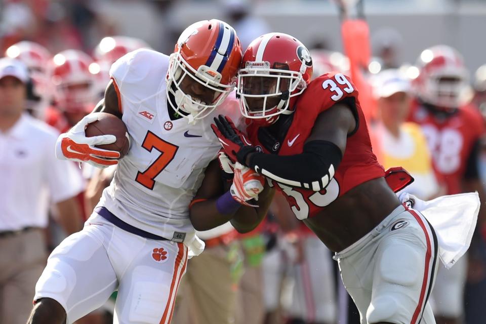 Aug 30, 2014; Athens, GA, USA; Clemson Tigers wide receiver Mike Williams (7) is pushed out of bounds by Georgia Bulldogs safety Corey Moore (39) during the first quarter at Sanford Stadium. Mandatory Credit: Dale Zanine-USA TODAY Sports