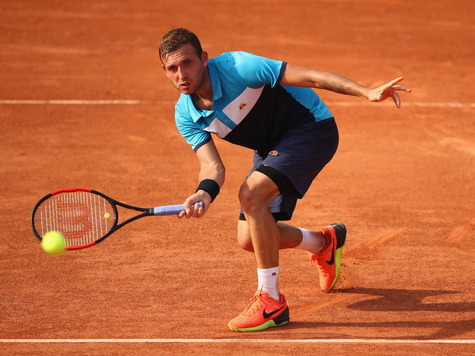 Great Britain's Dan Evans was one of the players to lose on the opening day: Getty