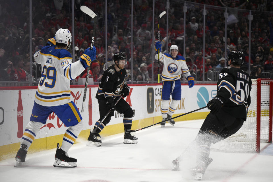 Buffalo Sabres right wing Alex Tuch, left, celebrates his goal with center Tage Thompson, near Washington Capitals defenseman Nick Jensen (3) and center Aliaksei Protas (59) during the first period of an NHL hockey game, Tuesday, Jan. 3, 2023, in Washington. (AP Photo/Nick Wass)