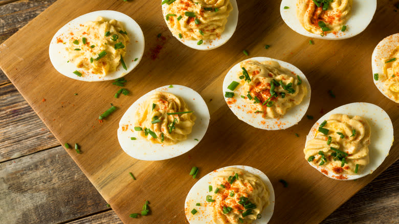 devilled eggs on wooden board