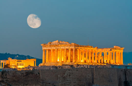 ACROPOLIS Crowning the city of Athens, the Acropolis—“High City” in Greek—seems to reach up into the clouds. Built from 461-429 B.C., under the Athenian statesman Pericles, the site comprises the Parthenon, the Temple of Athena Nike, the Propylaea and the Erechtheion, which together recall the wealth, power, and sophistication of ancient Greece. Dedicated to Athena, the Parthenon is the most important surviving example of Classical Greece, but the Erechtheion, with the stunningly carved Porch of the Caryatids, is an equally incredible sight. Insider Tip: Enter through the Beulé Gate (named for the French archeologist who discovered it in 1852) and make sure you have several hours to explore. (Photo: Nick Pavlakis/Shutterstock)