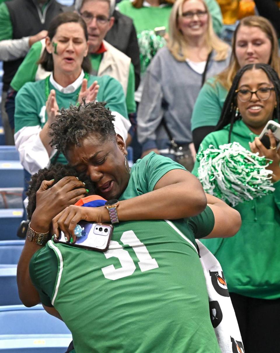 Myers Park’s Elijah Strong hugs his mother, Keishia Strong following the teams 74-60 victory over Richmond Senior in the NCHSAA state 4A championship game at the Dean Smith Center on Saturday, March 11, 2023.