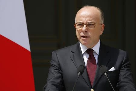 French Interior Minister Bernard Cazeneuve speaks at the ministry in Paris, France, June 22, 2016 after he authorised a short route allowing French trade unions to hold a protest march against labour reforms in the French capital on Thursday after an earlier decision to ban the demonstration. REUTERS/Stephane Mahe