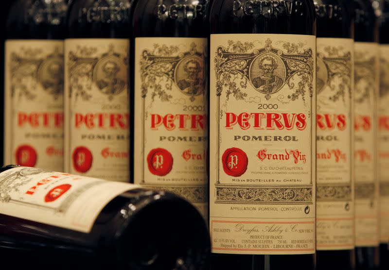 FILE PHOTO: Bottles of 2000 Chateau Petrus are shown at news conference ahead of wine auction in Hong Kong