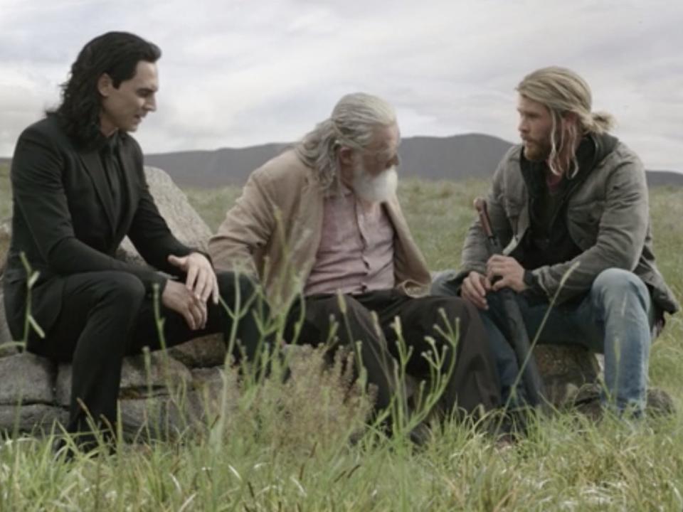 Loki, Odin, and Thor sitting together in "Thor: Ragnarok."