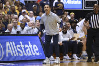 Marquette coach Shaka Smart watches the team play against Kansas during the first half of an NCAA college basketball game Tuesday, Nov. 21, 2023, in Honolulu. (AP Photo/Marco Garcia)