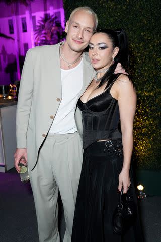 <p>Kevin Mazur/VF23/WireImage</p> George Daniel and Charli XCX attend the Vanity Fair Oscar Party Hosted by Radhika Jones at Wallis Annenberg Center for the Performing Arts in March 2023 in Beverly Hills