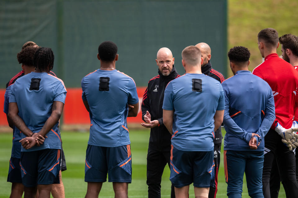 New Manchester United manager Erik ten Hag talks to players during a first -eam training session at Carrington Training Ground.