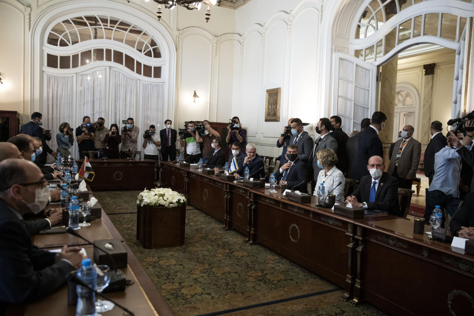 Israeli Foreign Minister Gabi Ashkenazi, third right, with Egyptian Foreign Minister Sameh Shoukry (not shown), during high-level talks to shore up a fragile truce between Israel and the Hamas militant group at the Tahrir Palace in Cairo, Egypt, Sunday, May 30, 2021. (AP Photo/Nariman El-Mofty)