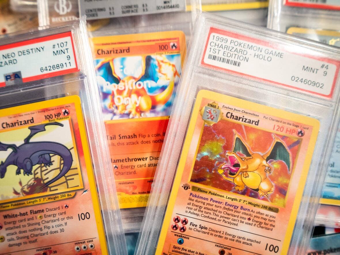 Pokémon cards have skyrocketed in value in recent years, with collectors purchasing some rare cards for over $1 million. Those featuring the character Charizard can be worth big bucks. Searches for 'Pokémon' have increased by more than 160 per cent on eBay.ca in the past five years. (Ritzau Scanpix/AFP/Getty Images - image credit)