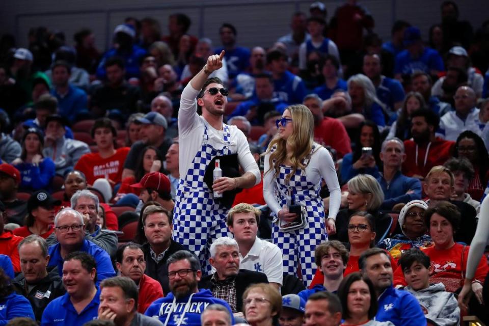 Kentucky fans cheer on their team against Louisville during Thursday’s game at the KFC Yum Center.