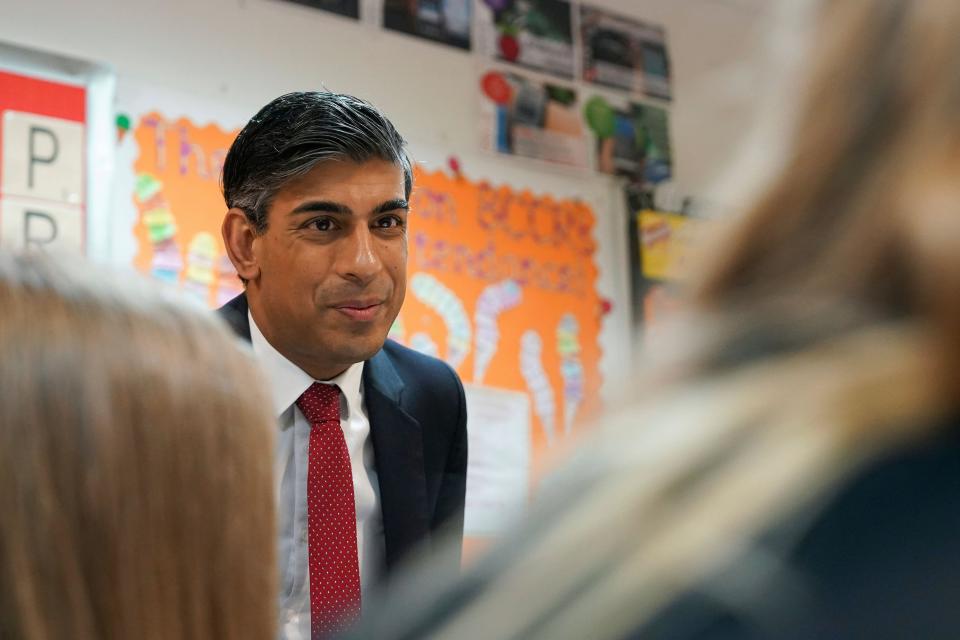 Britain's Prime Minister Rishi Sunak meets Year 9 students taking part in a personal development lesson as he visits Haughton Academy to outline plans for the banning of single use vapes, in Darlington, England, Monday, Jan. 29, 2024. (Ian Forsyth/Pool Photo via AP)