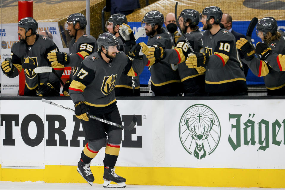 LAS VEGAS, NEVADA - JUNE 14:  Shea Theodore #27 of the Vegas Golden Knights is congratulated by his teammates after scoring a goal against the Montreal Canadiens during the first period in Game One of the Stanley Cup Semifinals during the 2021 Stanley Cup Playoffs at T-Mobile Arena on June 14, 2021 in Las Vegas, Nevada. (Photo by Ethan Miller/Getty Images)