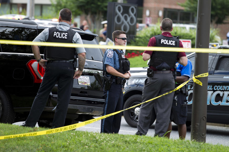 <p>Authorities work the scene after multiple people were shot at a newspaper office building in Annapolis, Md., Thursday, June 28, 2018. (Photo: Jose Luis Magana/AP) </p>