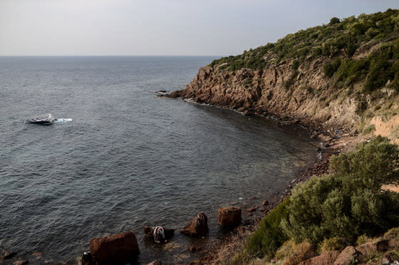 Ozan Kose-AFP/Getty ImagesA capsized boat is seen near the coast of Canakkale province, Turkey, Jan. 31, 2016, after authorities said migrants from Syria, Afghanistan and Myanmar drowned during an attempted crossing to Greece.