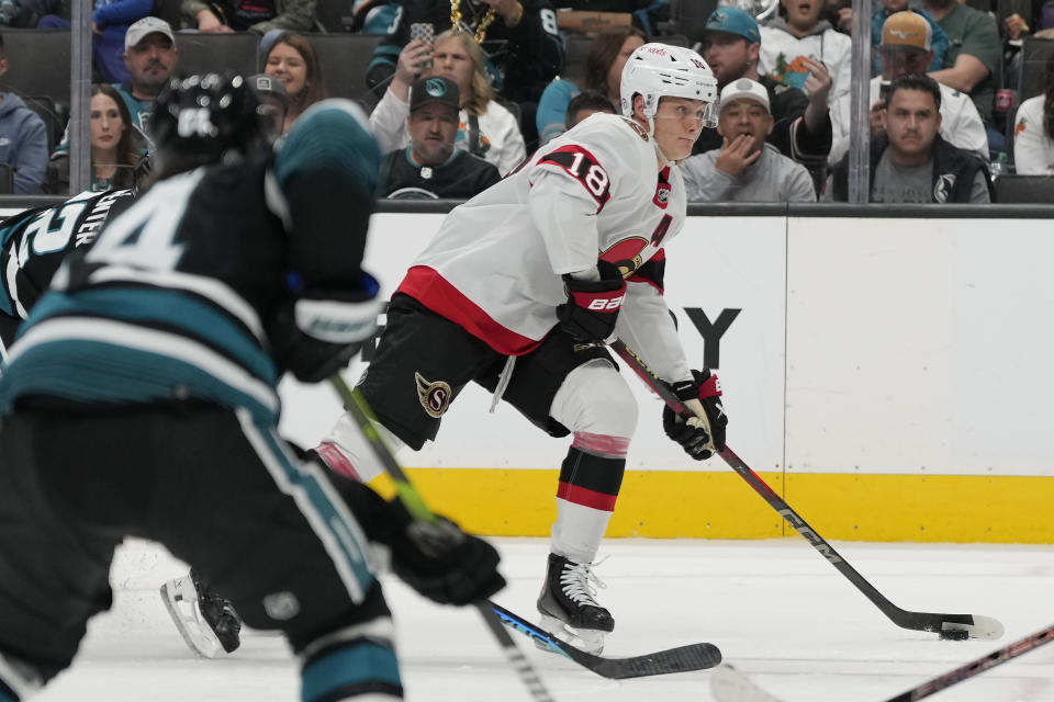 Ottawa Senators center Tim Stützle (18) skates with the puck before scoring a goal against the San Jose Sharks during the second period of an NHL hockey game in San Jose, Calif., Saturday, March 9, 2024. (AP Photo/Jeff Chiu)