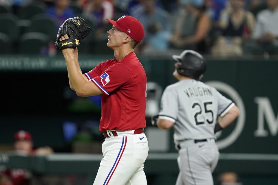 Texas Rangers starting pitcher Glenn Otto walks back to the mound after hitting Chicago White Sox's Andrew Vaughn with a pitch during the sixth inning of a baseball game Friday, Aug. 5, 2022, in Arlington, Texas. (AP Photo/Tony Gutierrez)