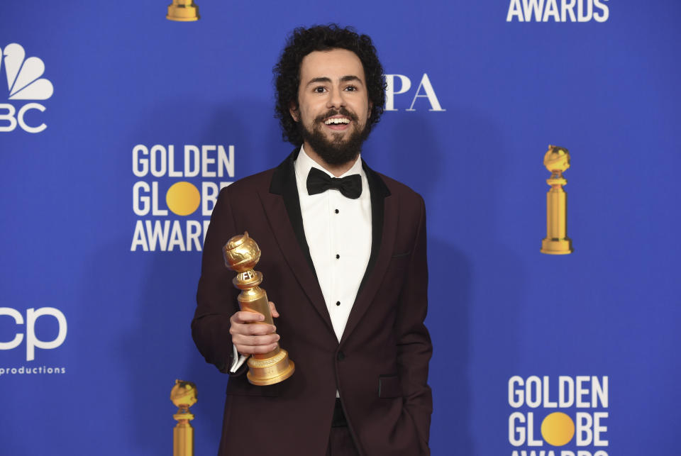 Ramy Youssef poses in the press room with the award for best performance by an actor in a television series, musical or comedy, for "Ramy" at the 77th annual Golden Globe Awards at the Beverly Hilton Hotel on Sunday, Jan. 5, 2020, in Beverly Hills, Calif. (AP Photo/Chris Pizzello)