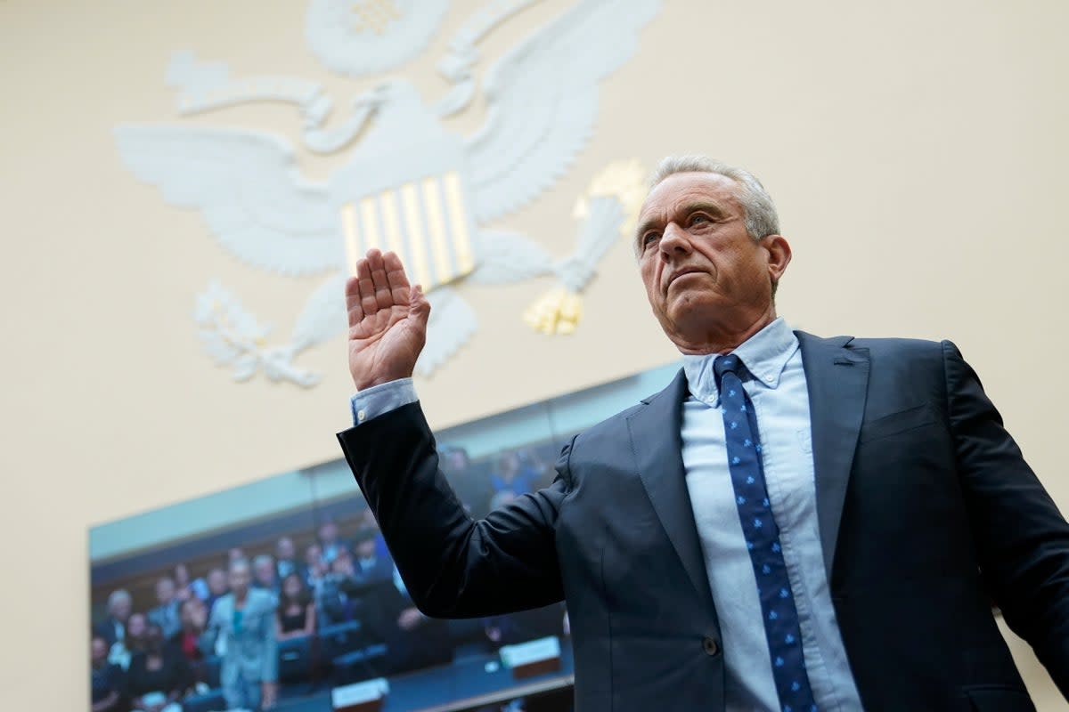 Robert F Kennedy, Jr., is sworn in before testifying at a House Judiciary Select Subcommittee on the Weaponization  of the Federal Government in July (Associated Press)