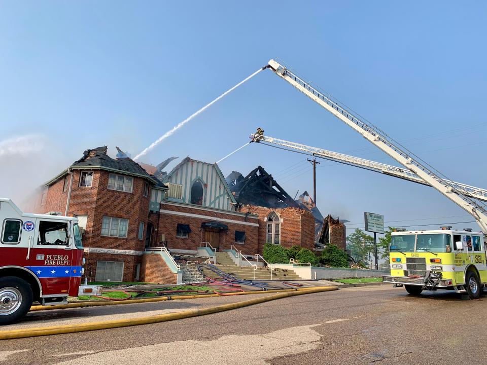 Pueblo Fire Department responders fight a fire on Monday, Aug. 9, 2021, at The Albany of Pueblo, a 130-year-old events venue on the 100 block of West Seventh Street in Pueblo, Colorado.