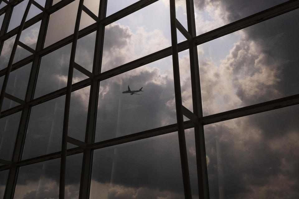 An aircraft operated by Cathay Pacific Airways takes off from Hong Kong International Airport in Hong Kong, on Wednesday, March. 8, 2023. Cathay Pacific Airways Ltd. said it was ready to rebuild as Hong Kong opened up to global visitors, despite reporting wider losses in 2022. (AP Photo/Louise Delmotte)