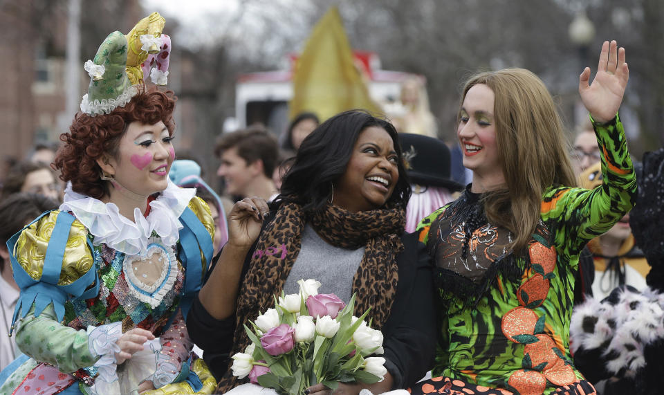 Guan-Yue Chen, Hasty Pudding Theatricals President, left, and Dan, Milashewski, vice president, right, ride with actress Octavia Spencer during a parade to honor Spencer as the Hasty Pudding Theatricals Woman of the Year Thursday, Jan. 26, 2017, in Cambridge, Mass. (AP Photo/Stephan Savoia)