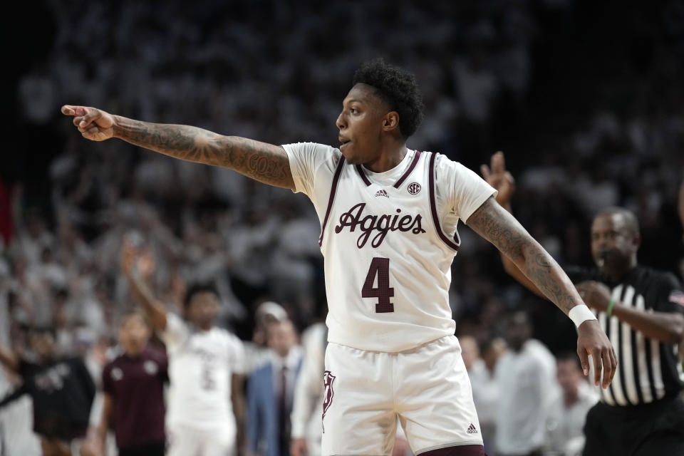 Texas A&M guard Wade Taylor IV (4) reacts after making a 3-point basket during the first half of an NCAA college basketball game against Tennessee, Saturday, Feb. 10, 2024, in College Station, Texas. (AP Photo/Sam Craft)